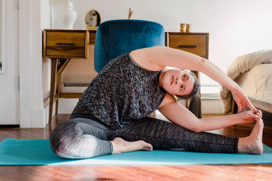 Serene woman in a comfortable yoga pose in a beautifully lit, calm room